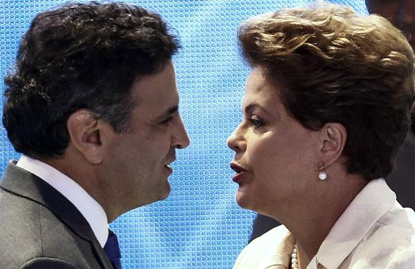 A&eacute;cio Neves (PSDB) e Dilma Rousseff (PT) durante primeiro debate realizado pela TV Bandeirantes, ainda no primeiro turno (Miguel Schincariol/ AFP)