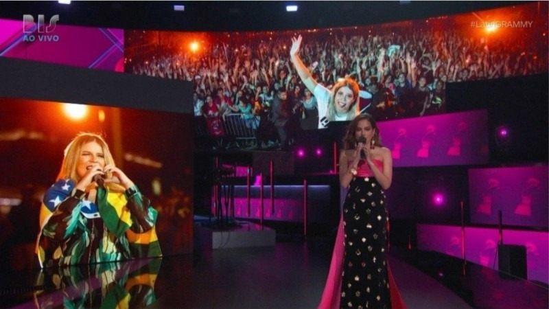  homenagem para Marília Mendonça e musical de abertura no palco principal comandado pela cantora cubana Gloria Estefan com Anitta, Carlinhos Brown e Giulia Be (Reprodução/ BIS)