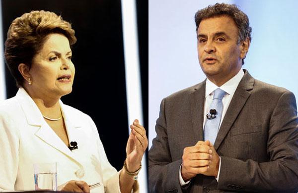 Dilma Rousseff e A&eacute;cio Neves durante debate na TV Record na noite deste domingo (19) (Miguel Schincariol/ AFP)