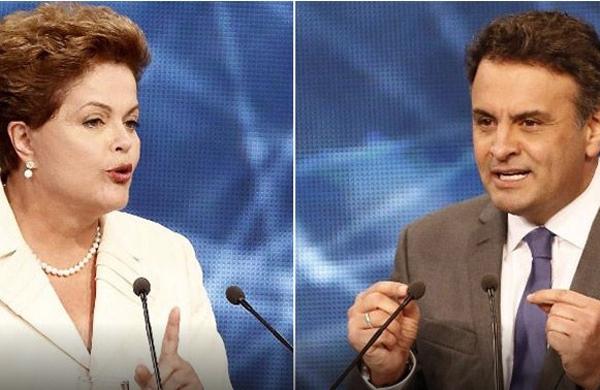 Os presidenci&aacute;veis Dilma (PT) e A&eacute;cio (PSDB) se encontram em debate promovido pelo Grupo Bandeirantes nesta ter&ccedil;a-feira (14)  ( Divulga&ccedil;&atilde;o)