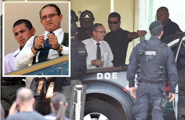 Imagens do fim do sequestro de funcion&aacute;rio de hotel de Bras&iacute;lia (ao fundo); no detalhe, o sequestrador Jac Souza dos Santos, ao lado da v&iacute;tima (Evaristo Sa/ AFP)